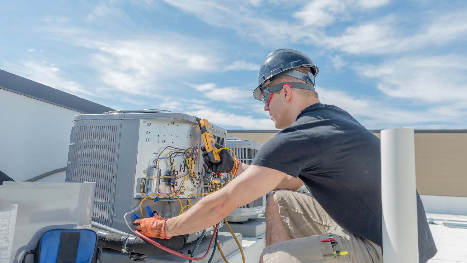 A professional repairing a HVAC unit