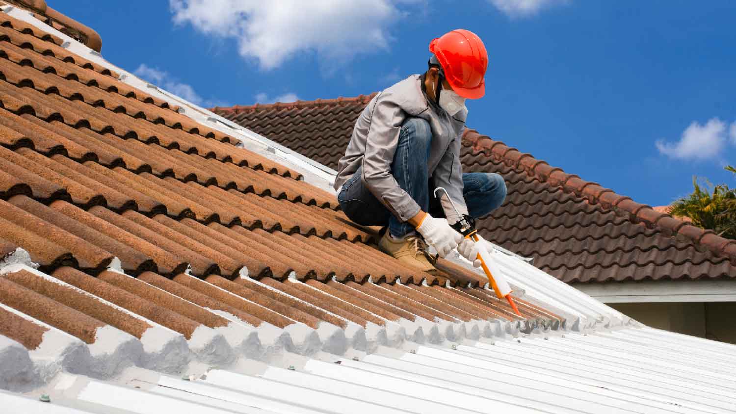 A professional sealing a roof