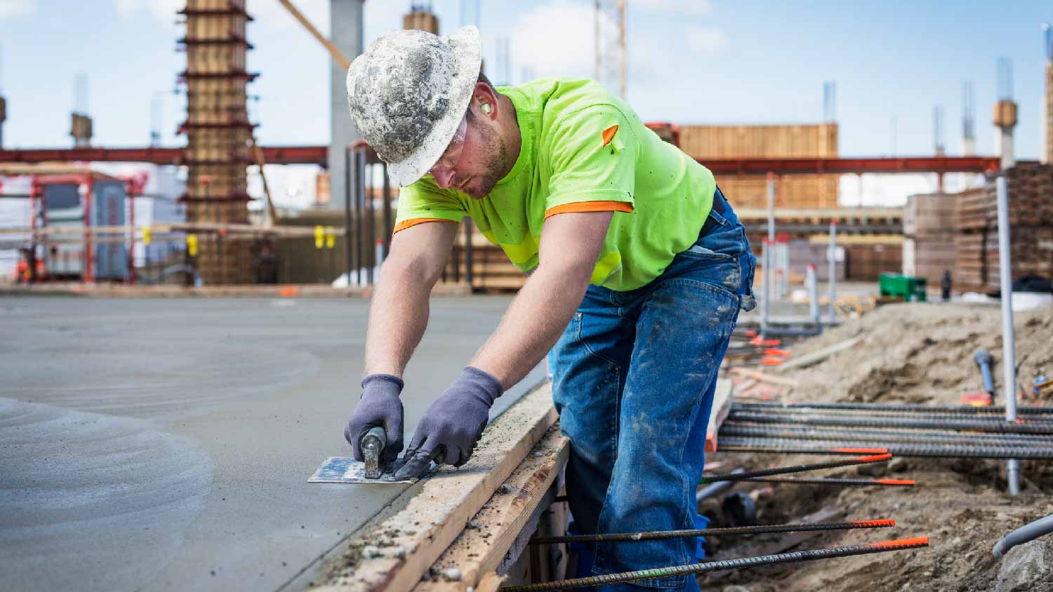 A professional working with concrete on a construction site