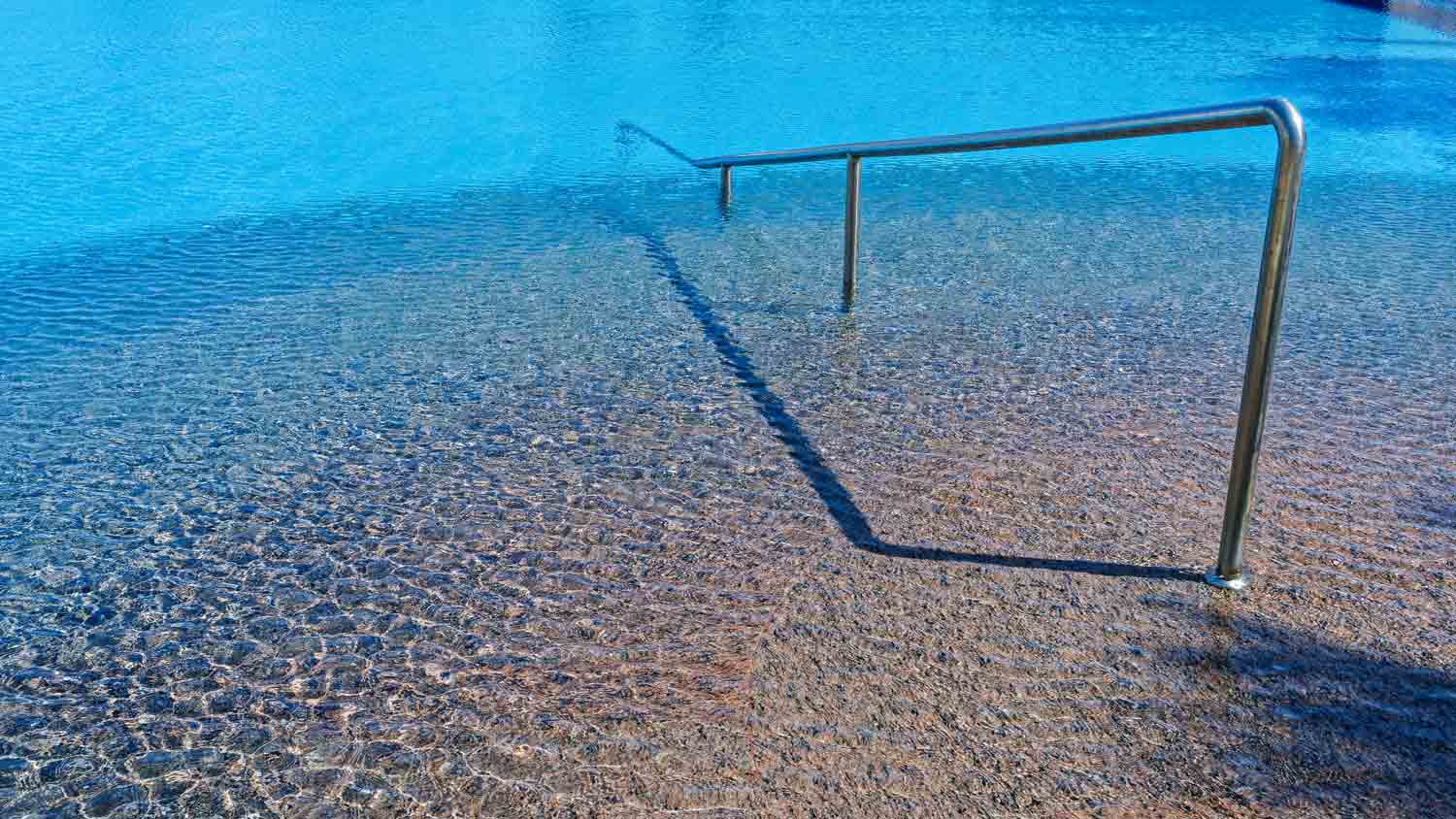 metal railing in pool entry  