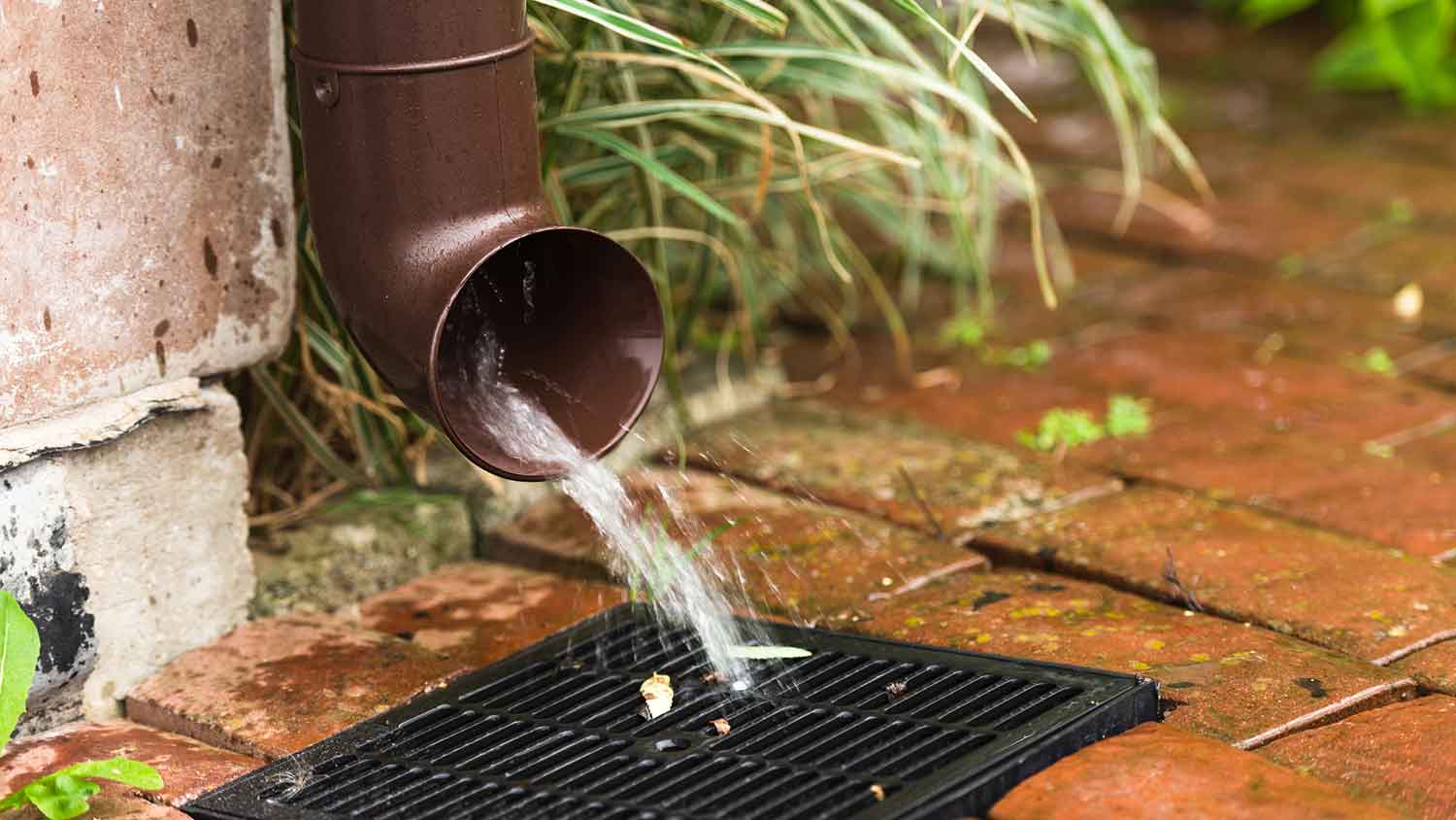 Downspout directing rainwater away from the house