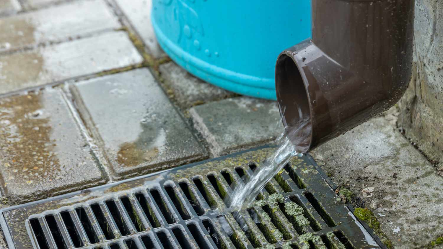 close up on rainwater draining gutter
