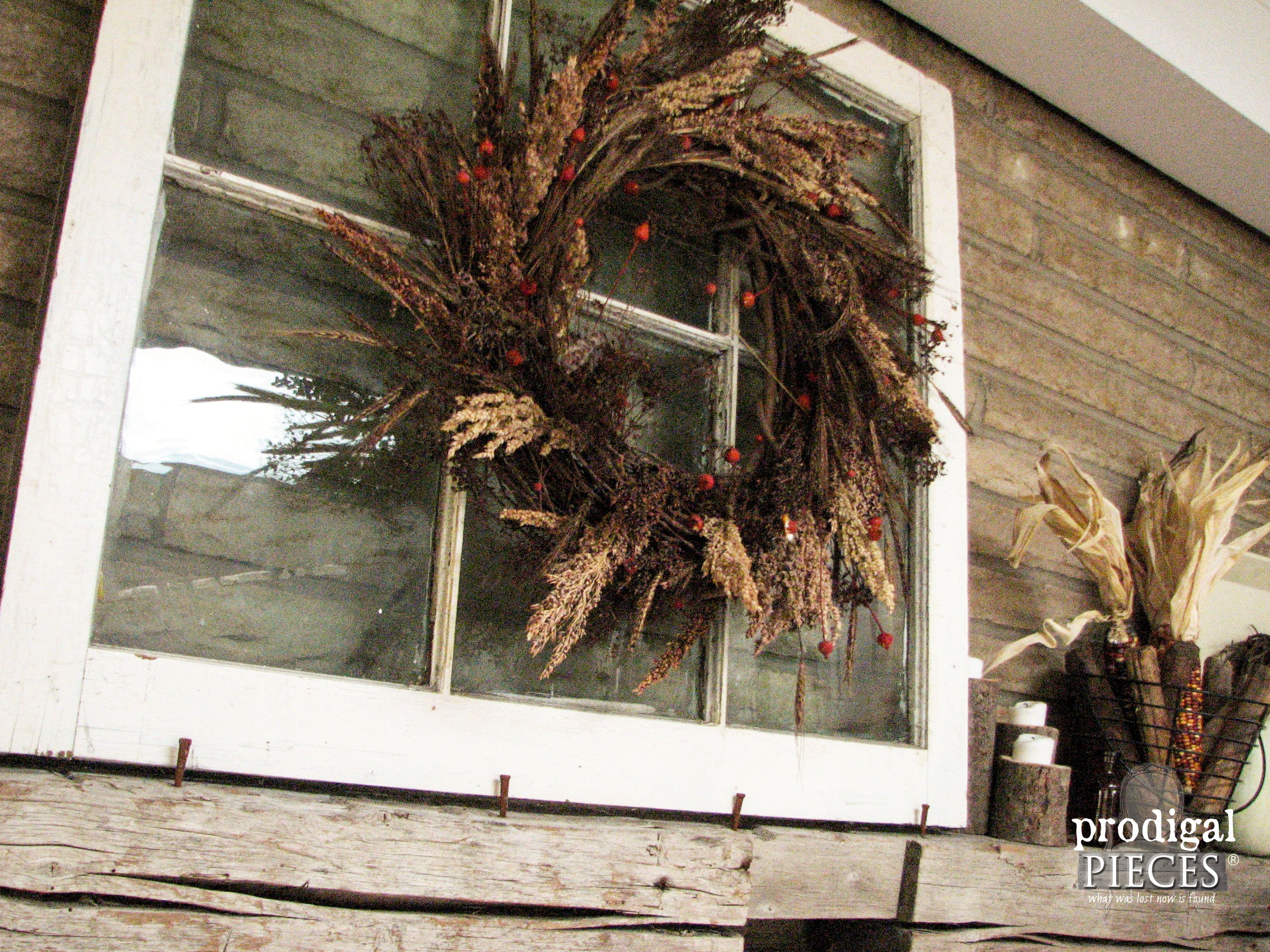 wreath framed by old window