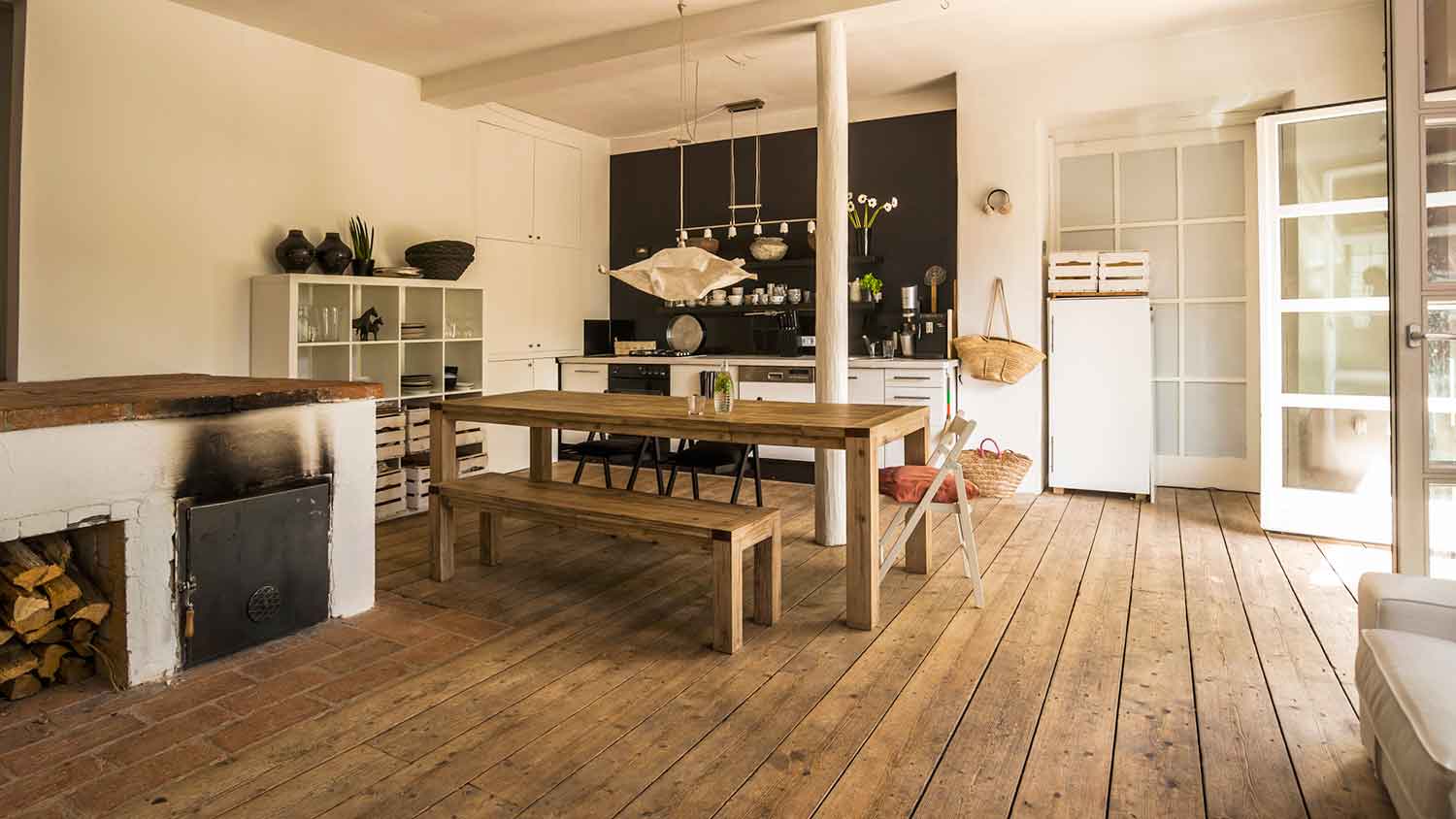 Reclaimed wood flooring installed in a rustic dining room