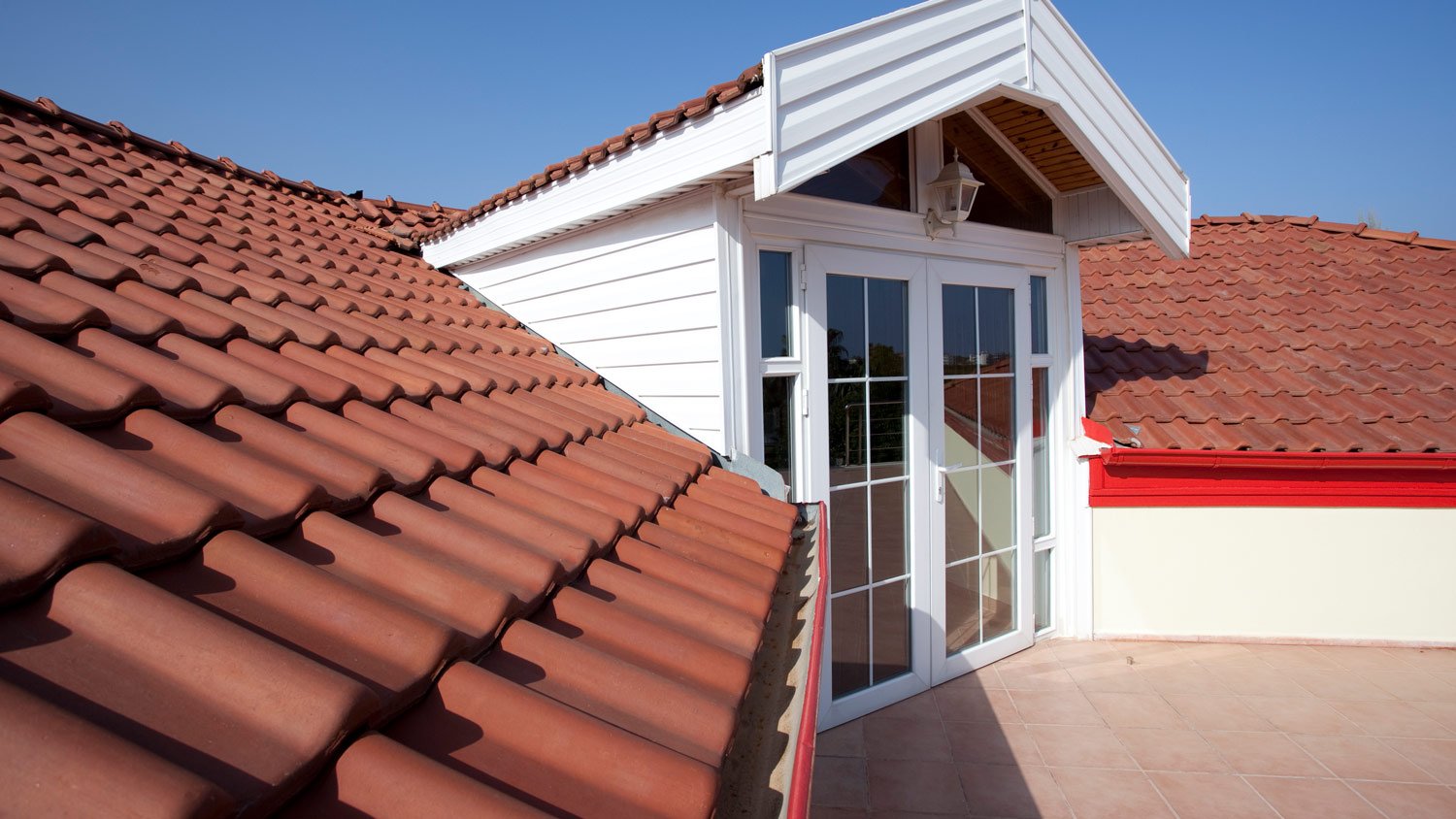 Balcony with red stone roof.  