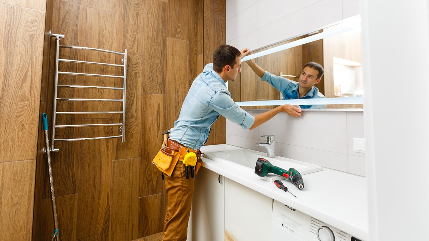 bathroom technician installing tub