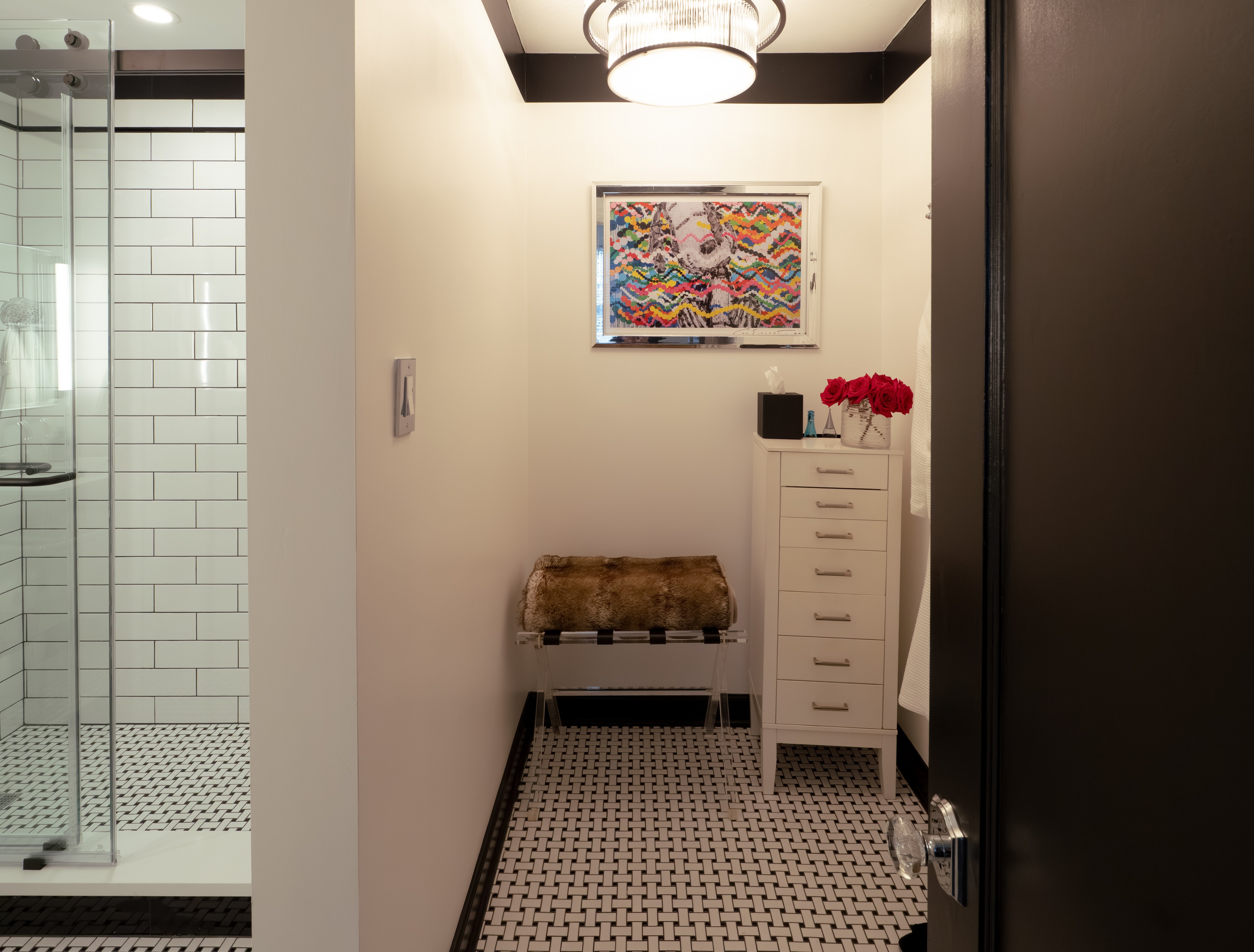 Bathroom entryway with vintage basketweave tile floor