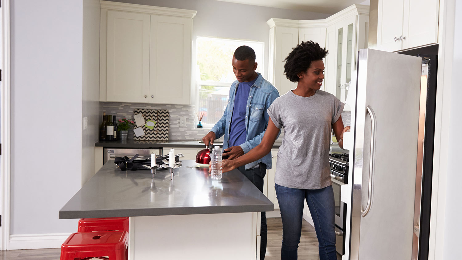 Couple in small rental kitchen
