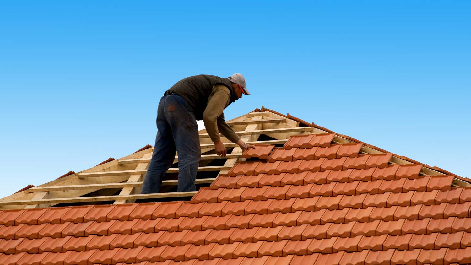 repairing red tile on roof