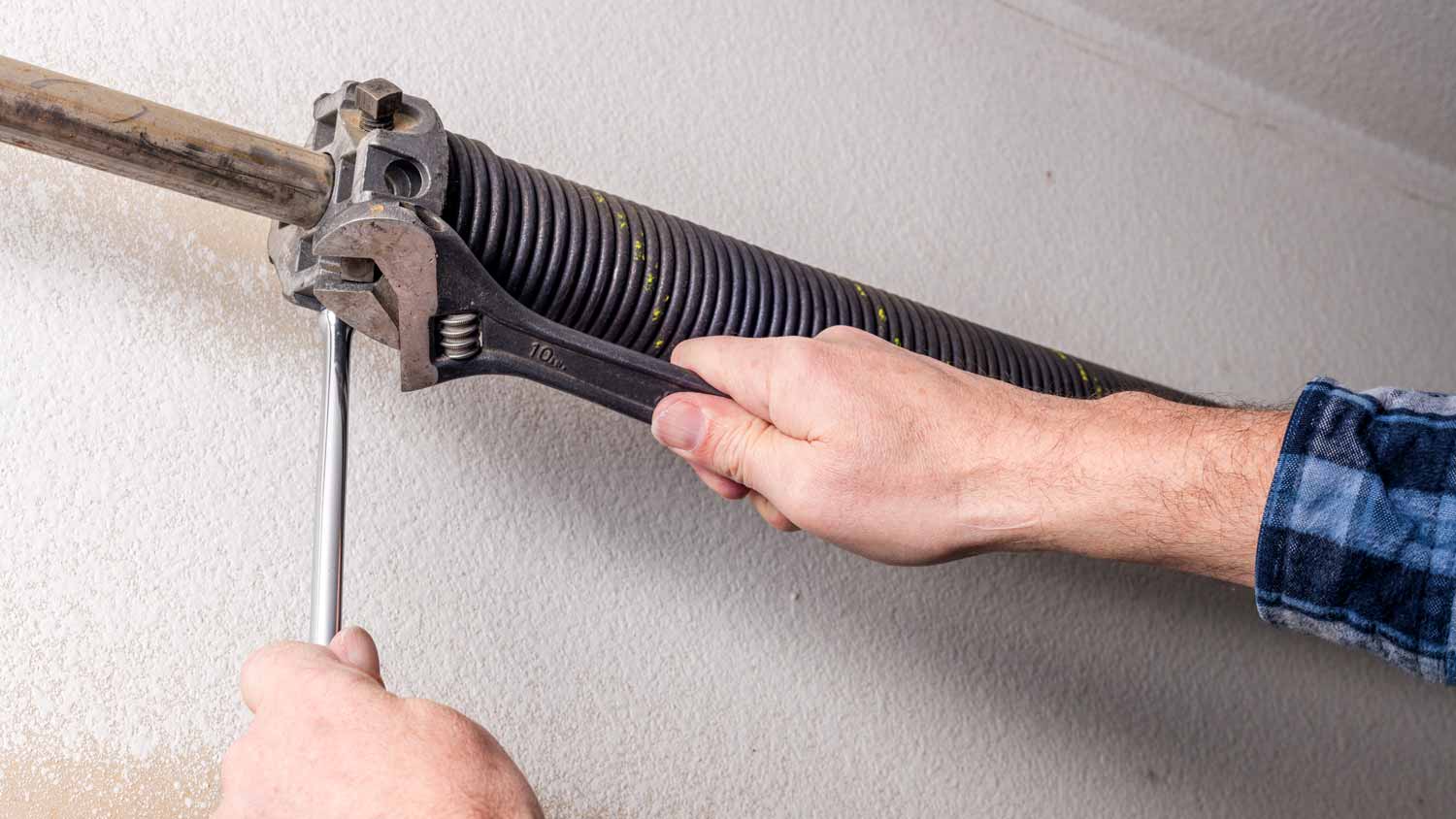 man repairing broken spring