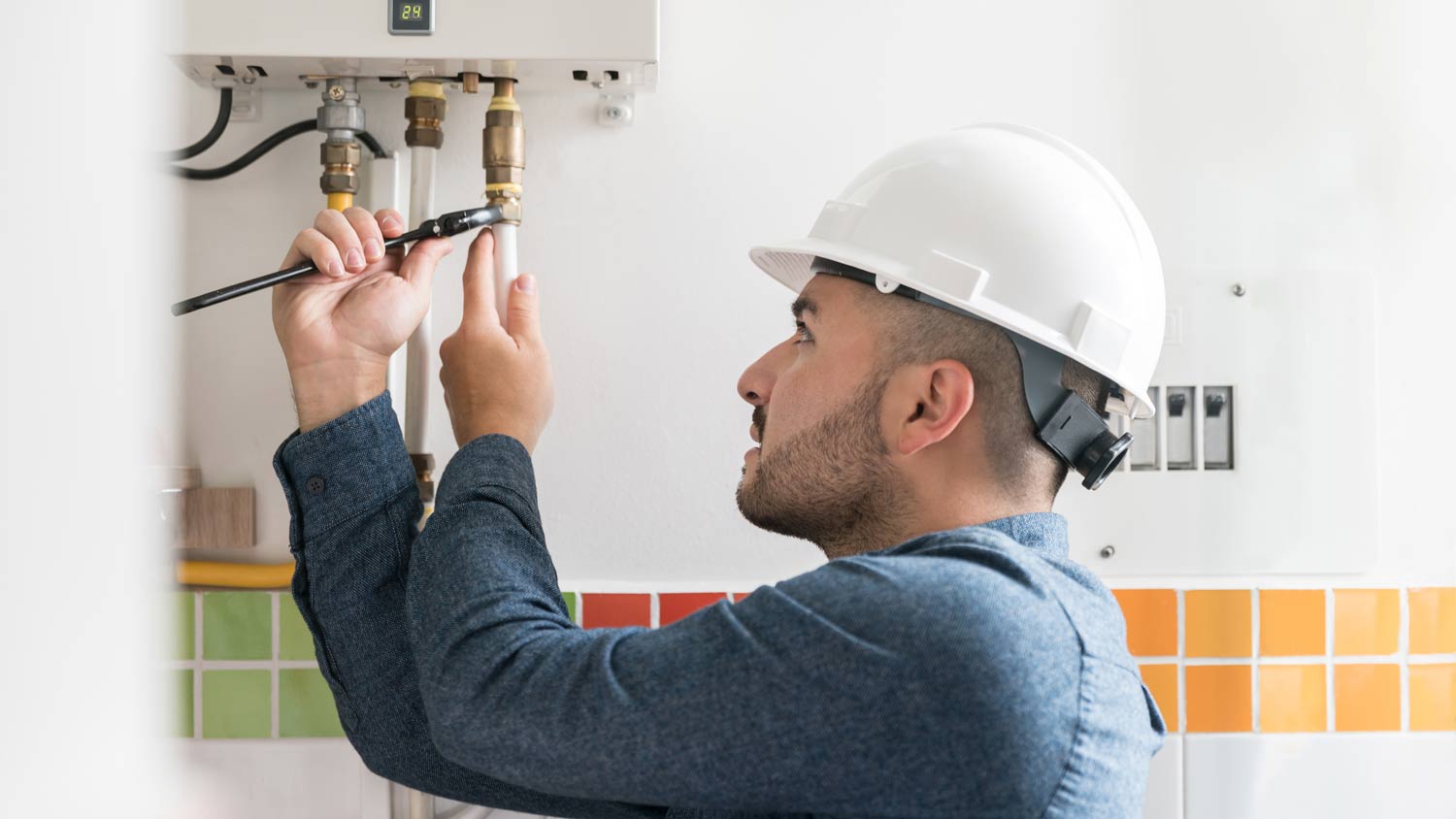 repairman fixing boiler