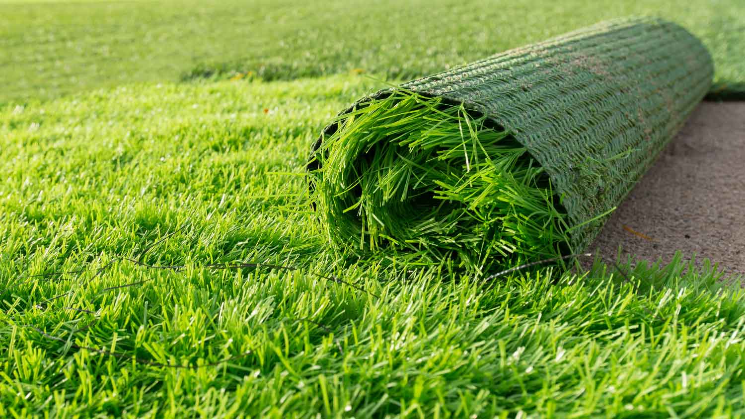 Closeup of artificial grass roll ready to be installed