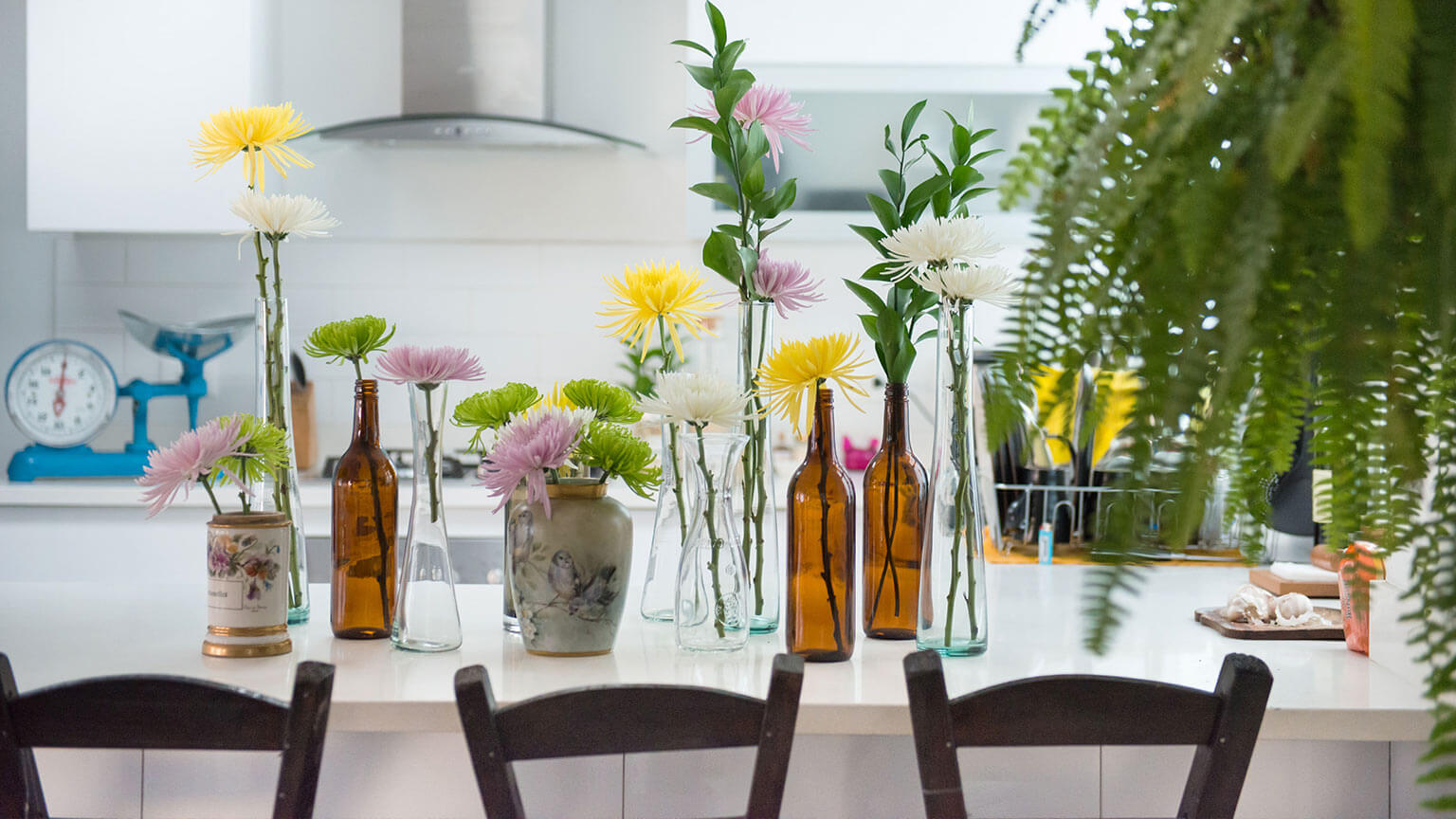 repurposed flower vases on kitchen counter