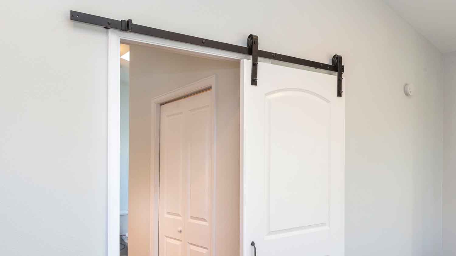 Flat track installed on a barn style door