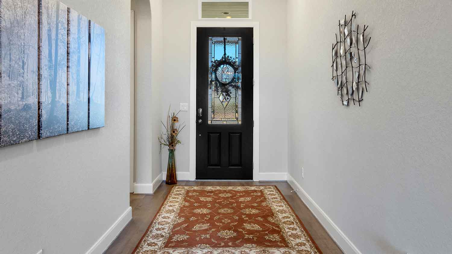 Residential hallway with black entry door