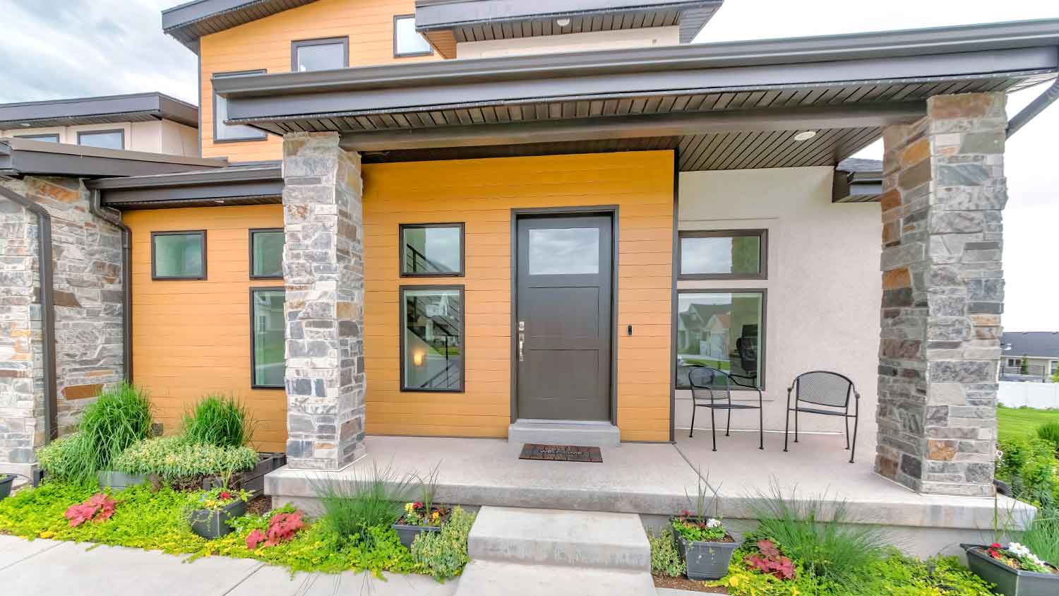 Suburban house covered with panel siding  