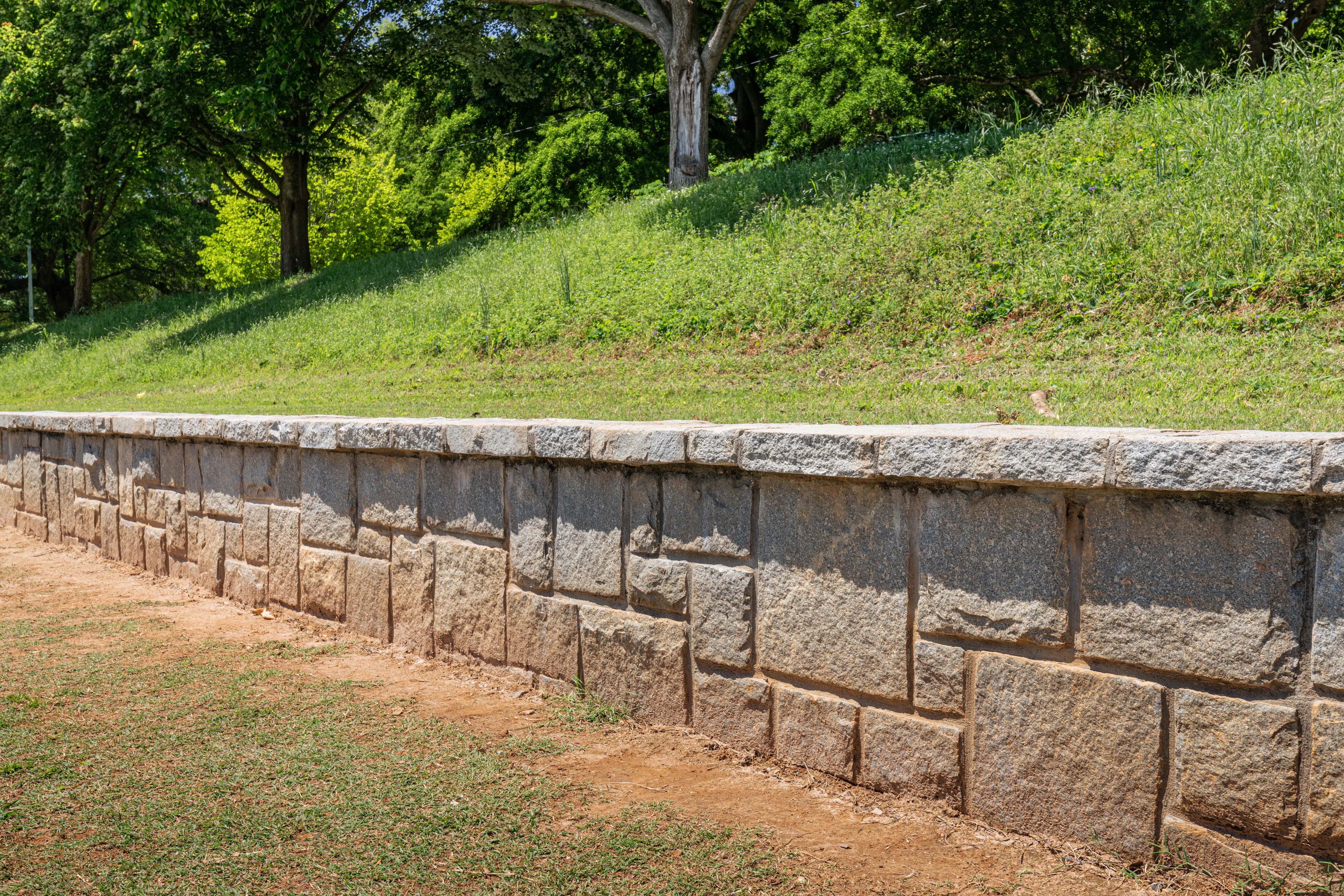 Stone retaining wall in backyard