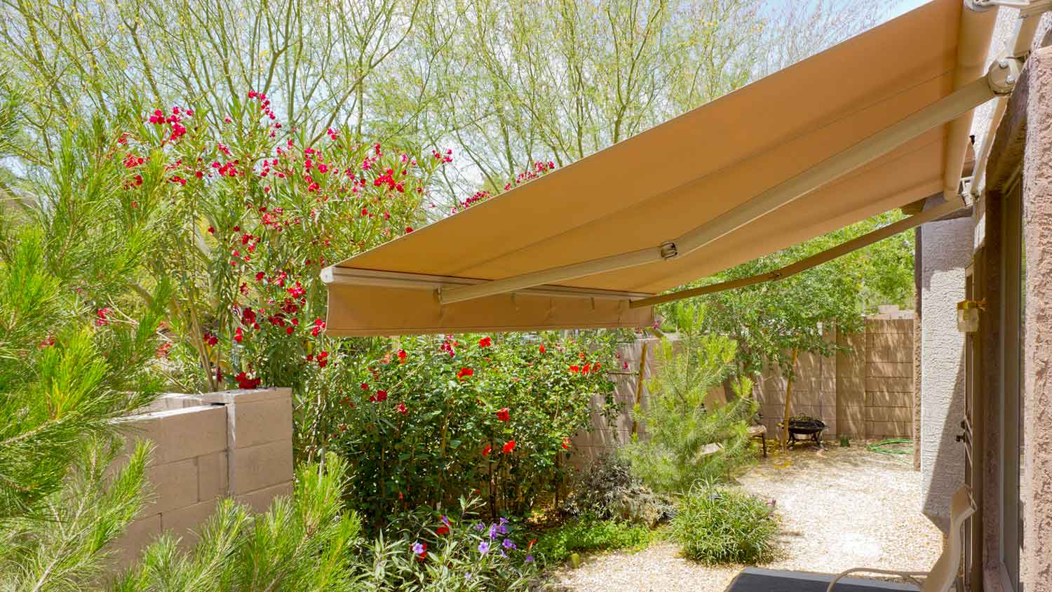 Retractable slopped awning installed on the patio