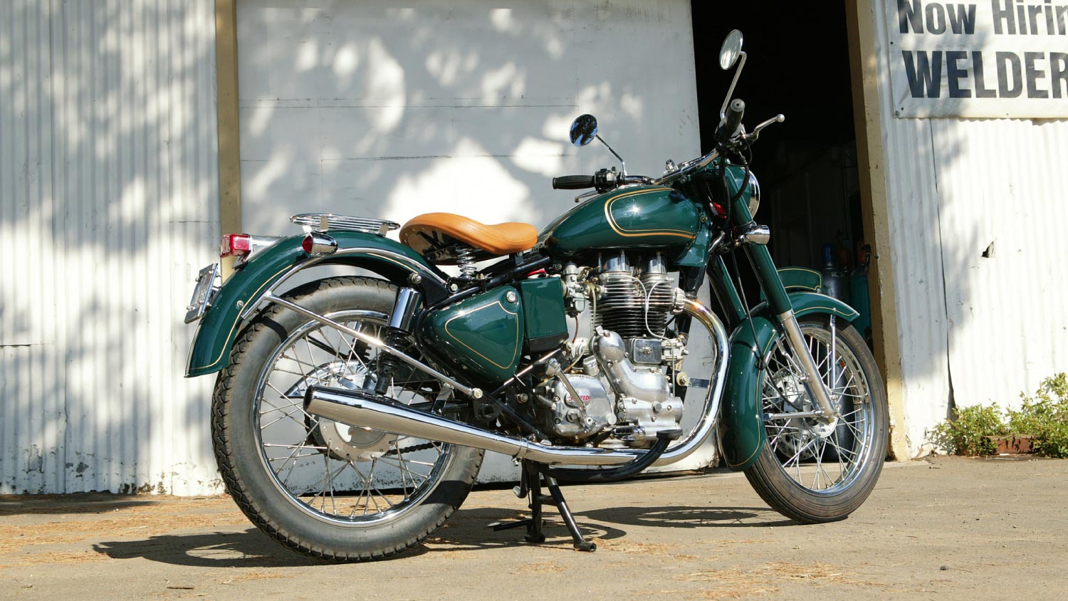 A retro motorcycle parked at a warehouse