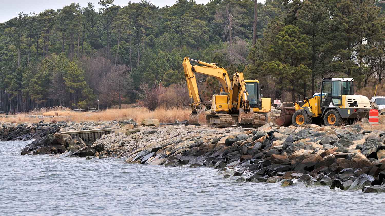 Using heavy equipment to rebuild a rip rap