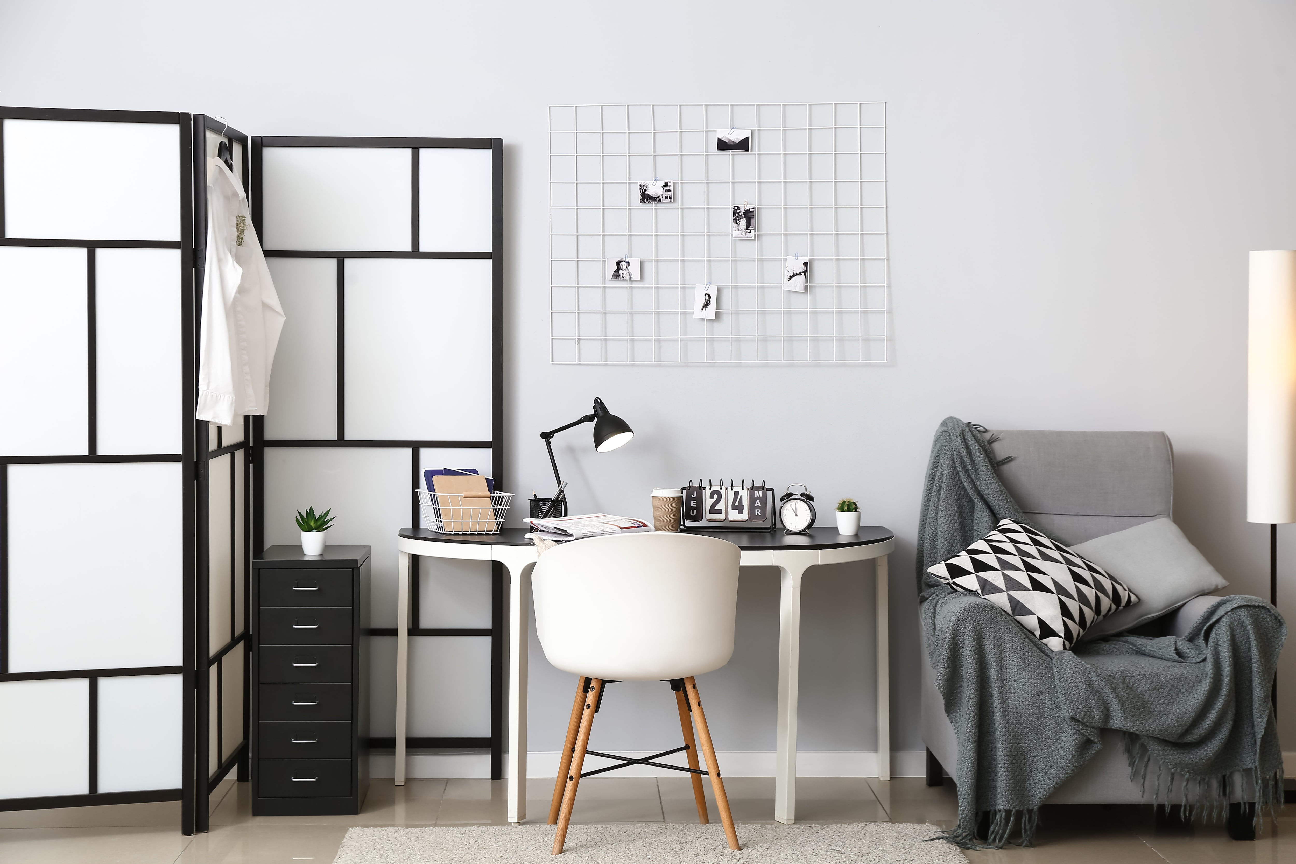 Work-from-home office with black and white privacy screen