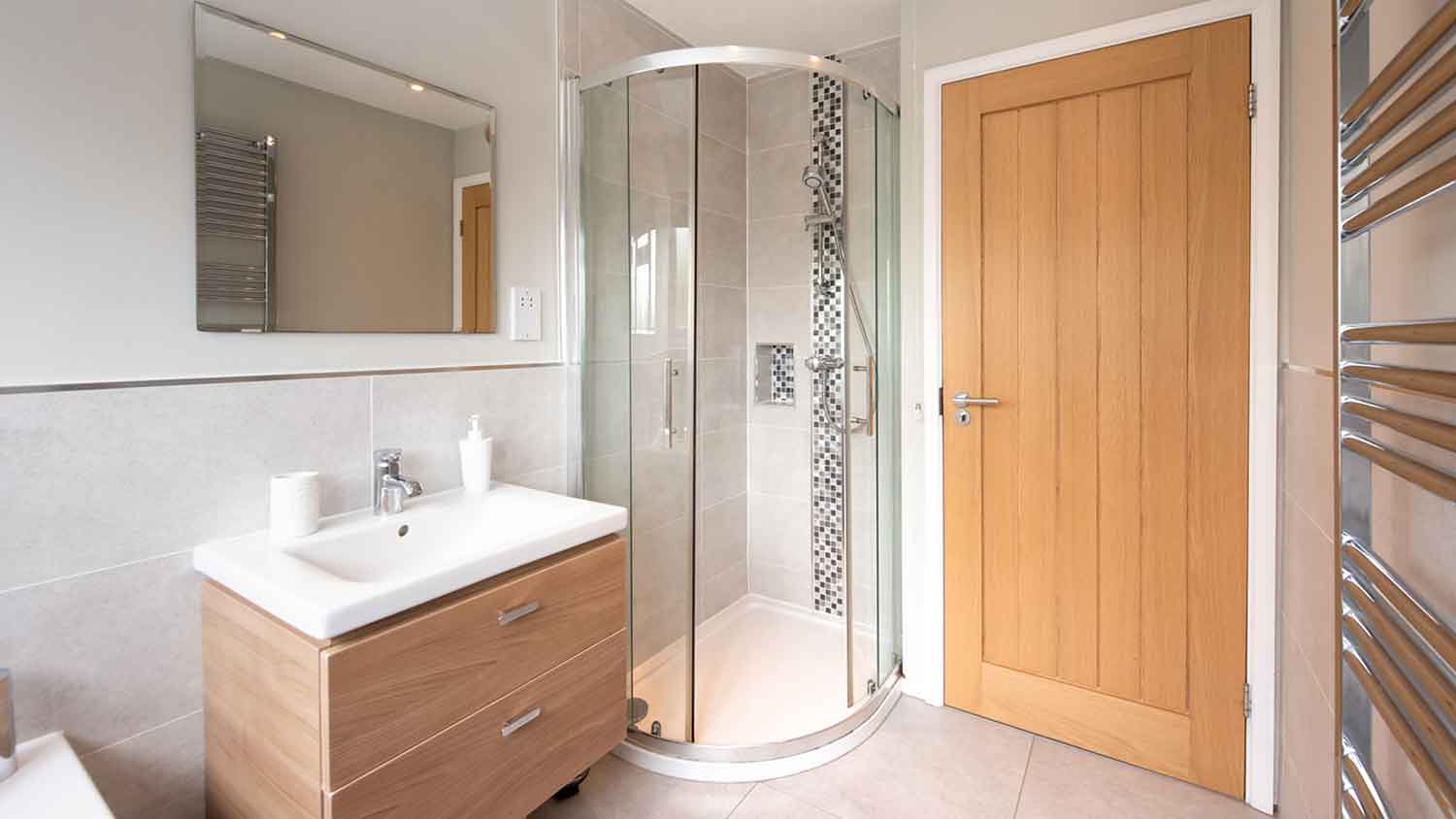 Small bathroom with a round shower door