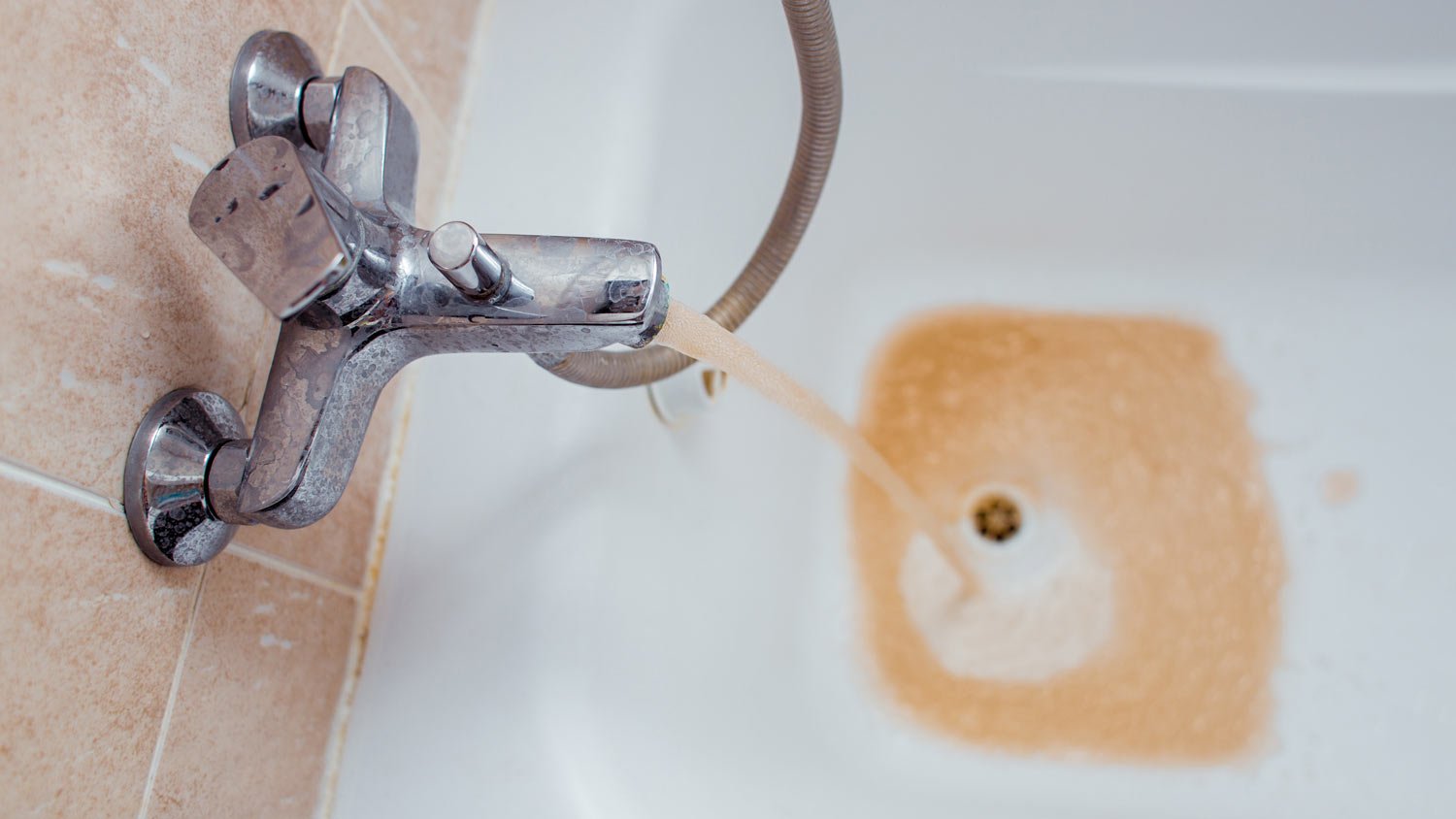 Rusty water coming from bathtub