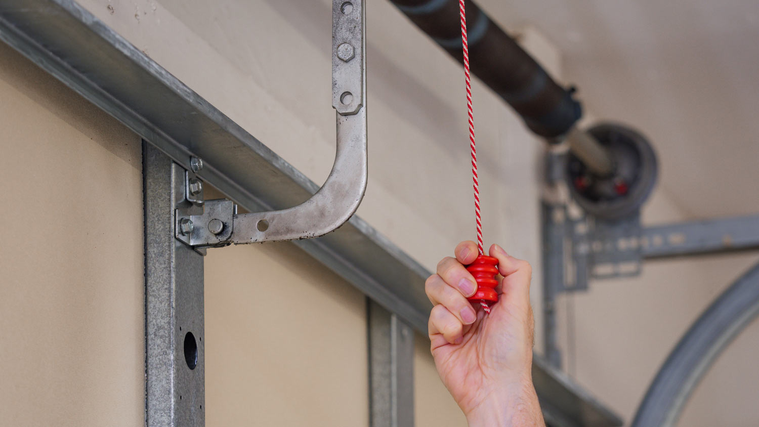 man pulling manual safety release cord