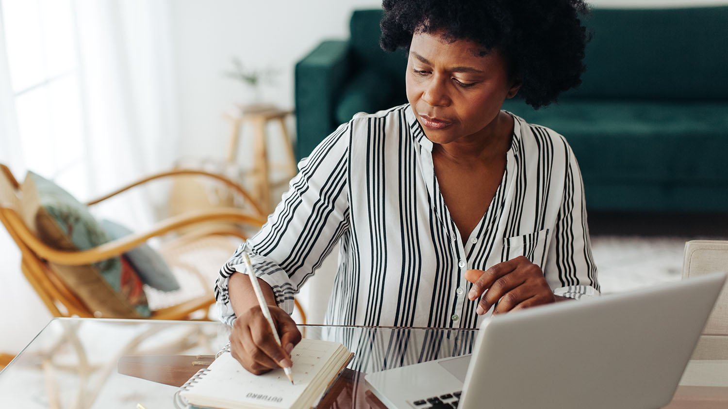 woman writing in planner