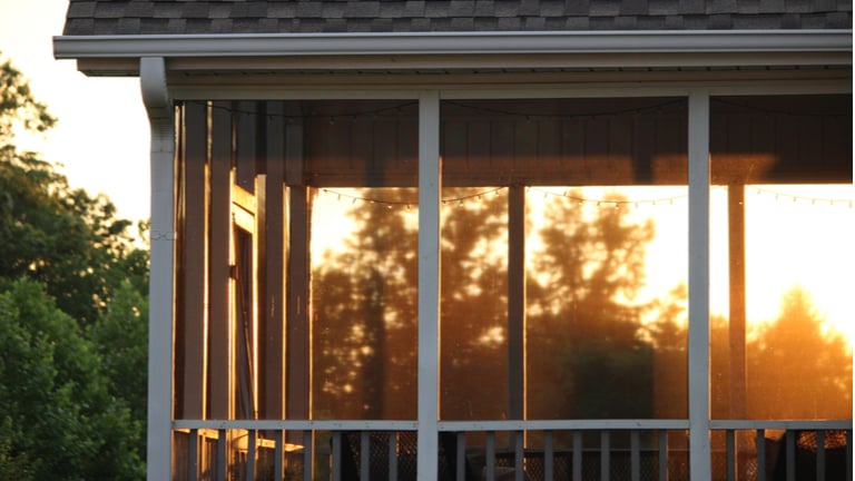 Close up of screened in porch during a sunset