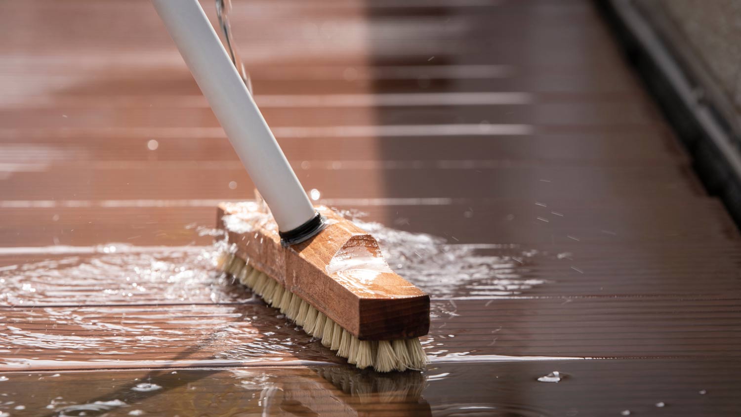 scrubbing brush wood deck