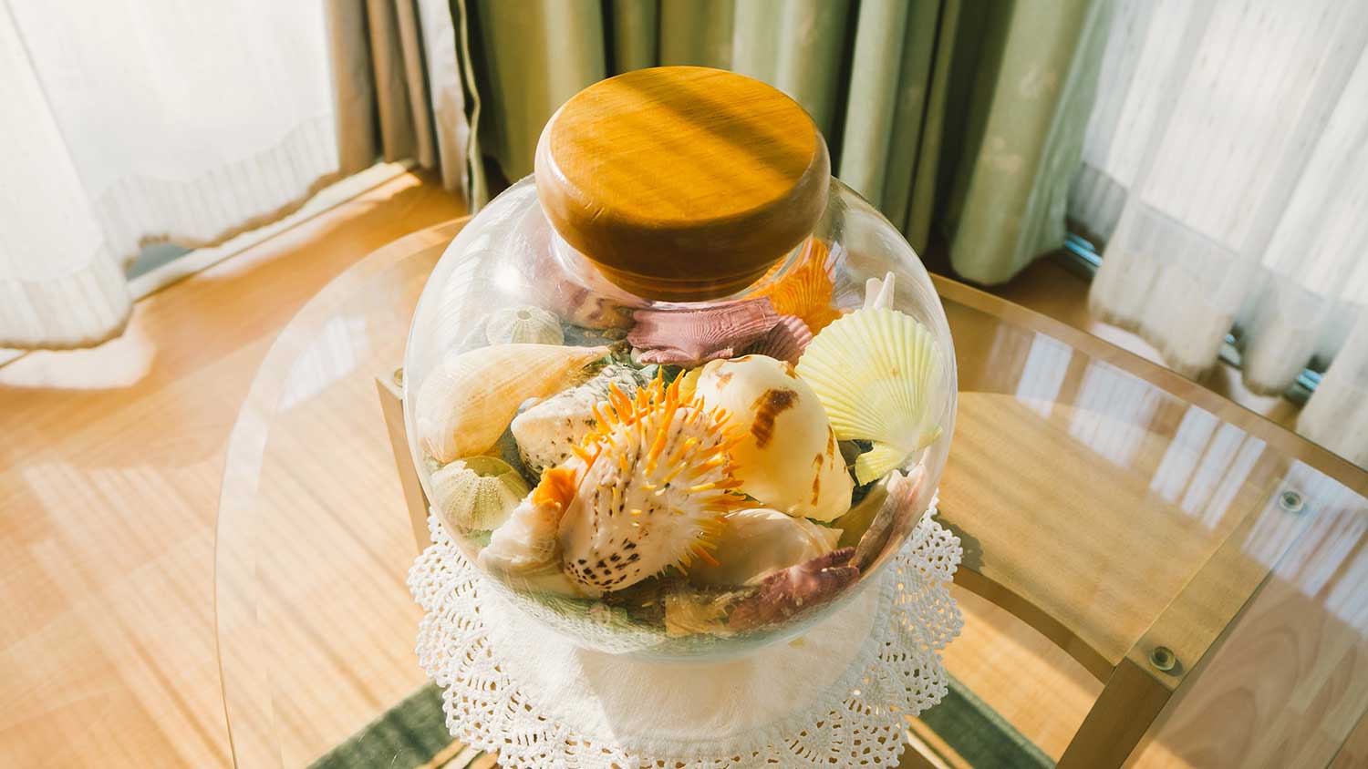 Colorful seashells in a decorative jar