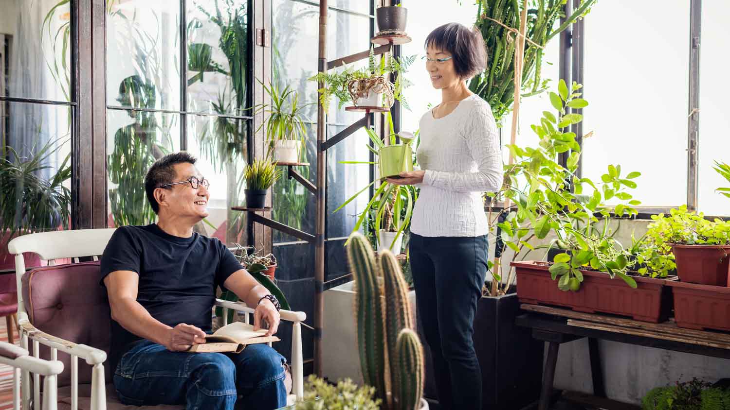 A senior couple spending time in their sunroom