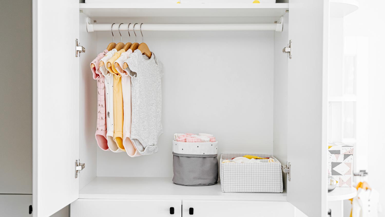 Using baby clothes hangers to organise a baby wardrobe