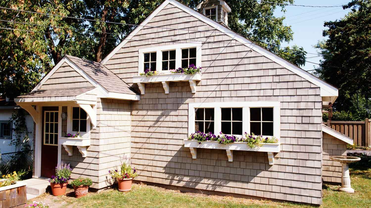 Shake wood siding installed on a cottage-style house