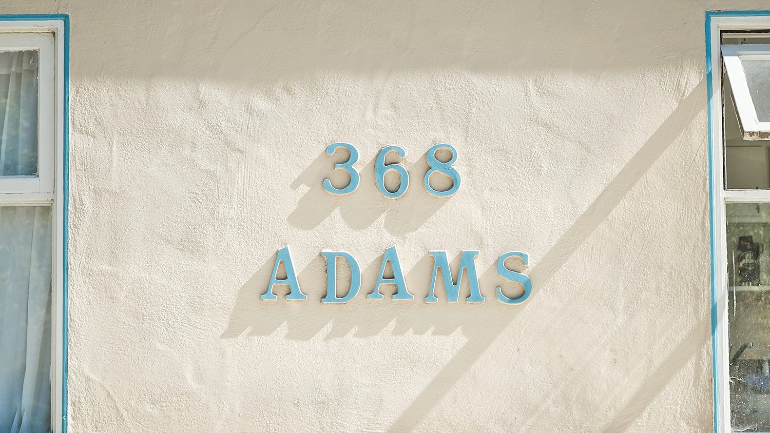 Address number (368) and last name (Adams) on outside exterior of home