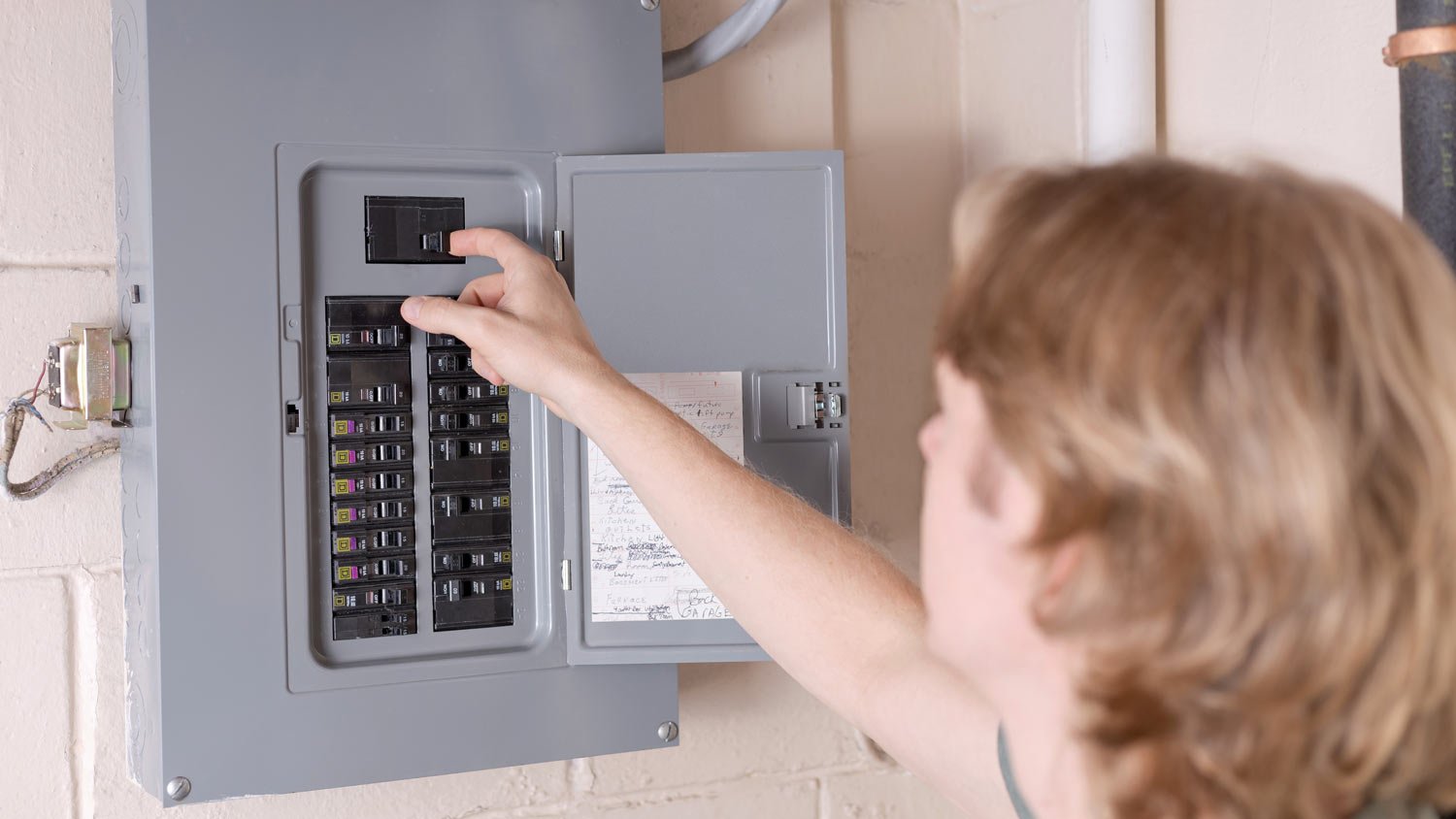 man shutting off power