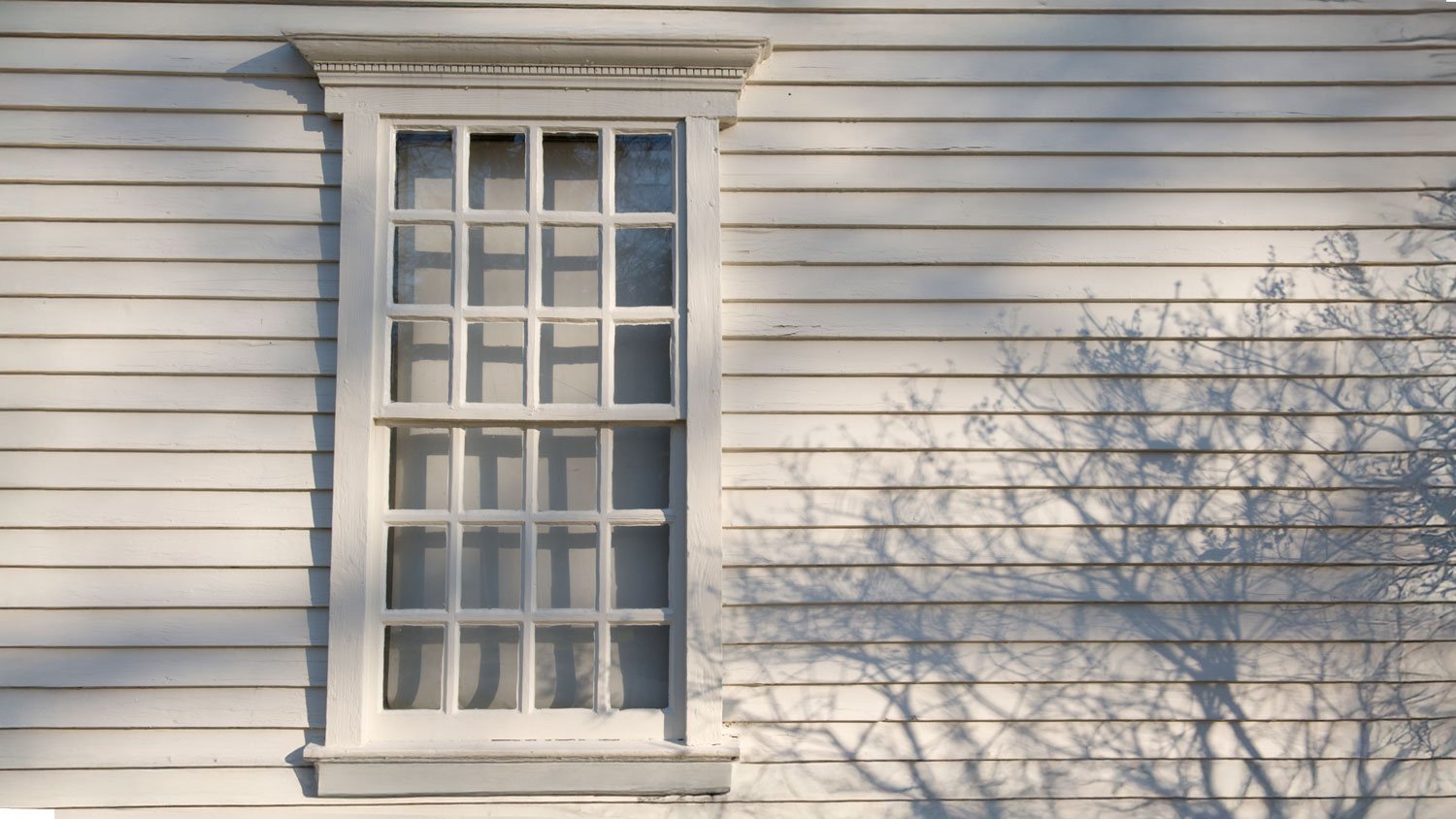 Exterior of white window and house