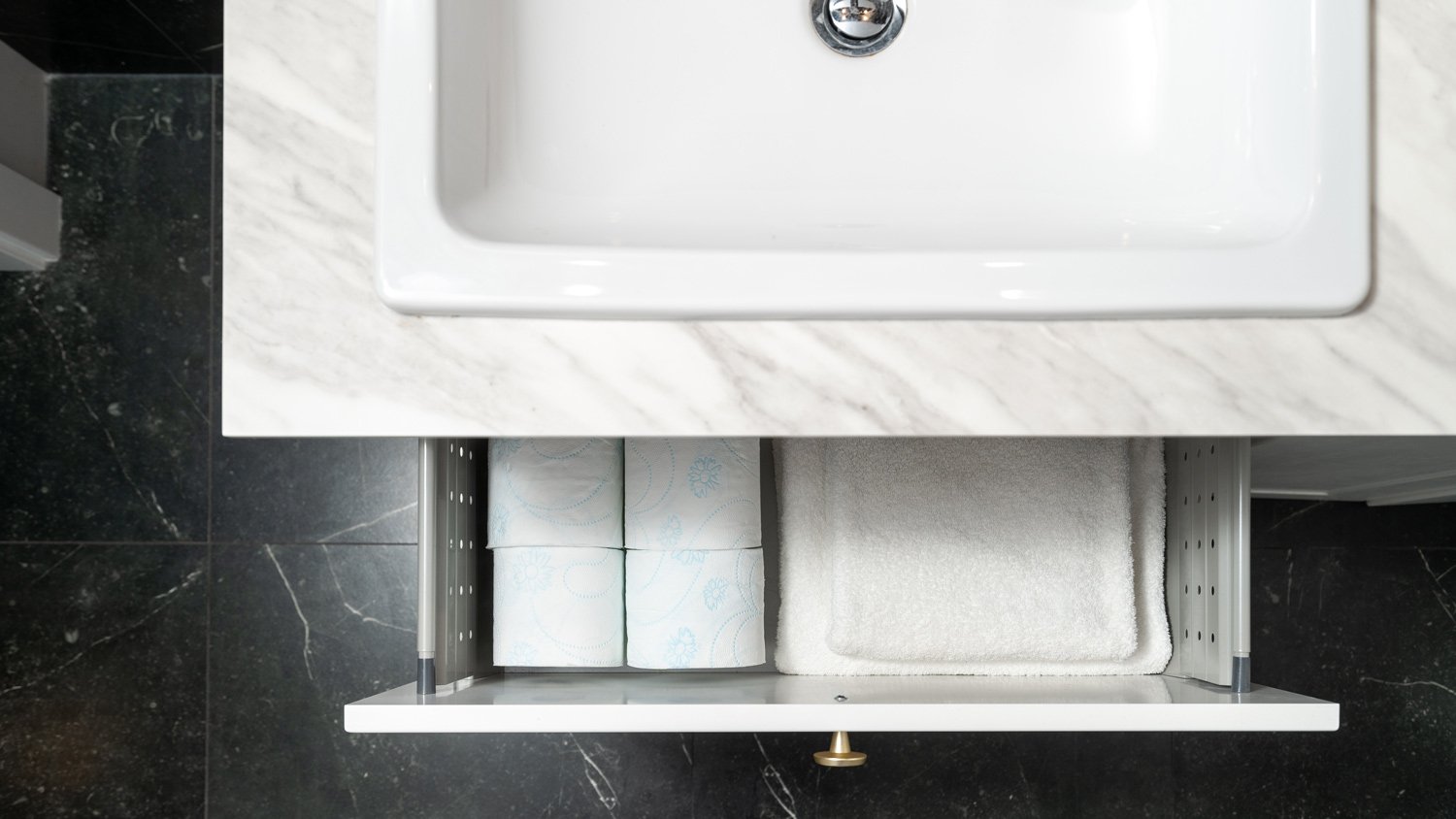 Toilet tissue rolls storage in box of cupboard in restroom