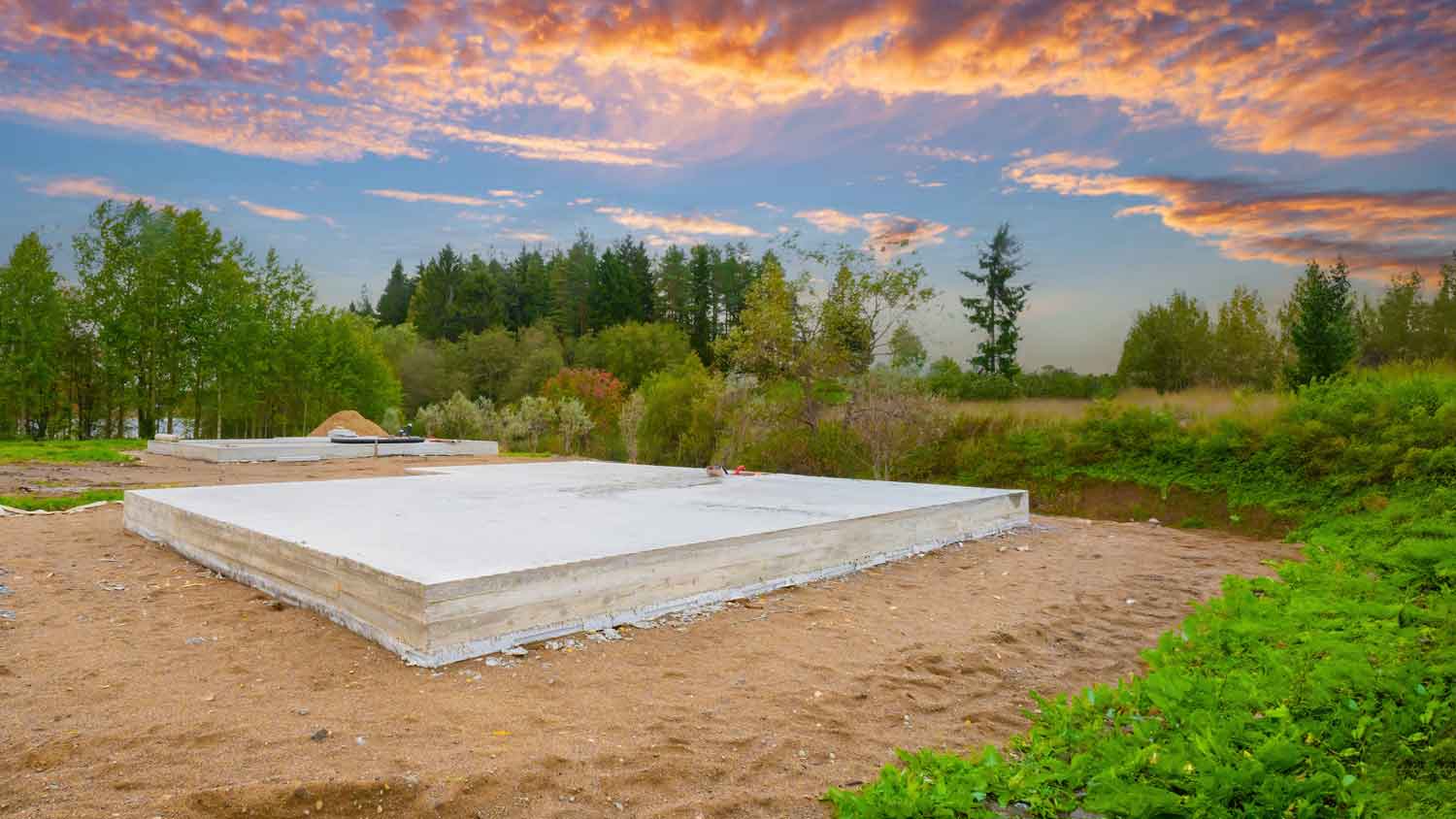 A slab-on-grade foundation at sunset