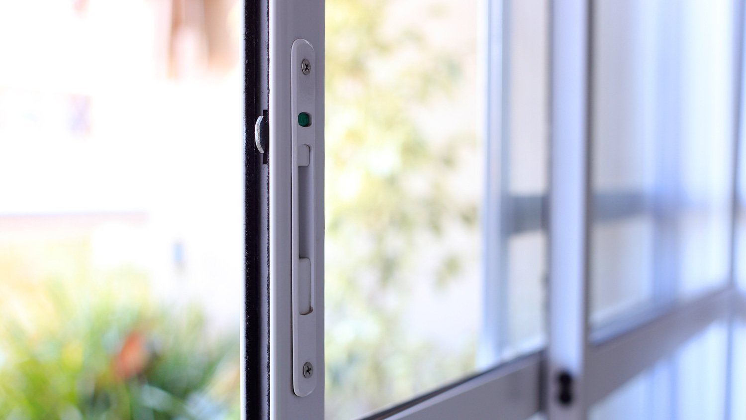 A white color sliding door lock