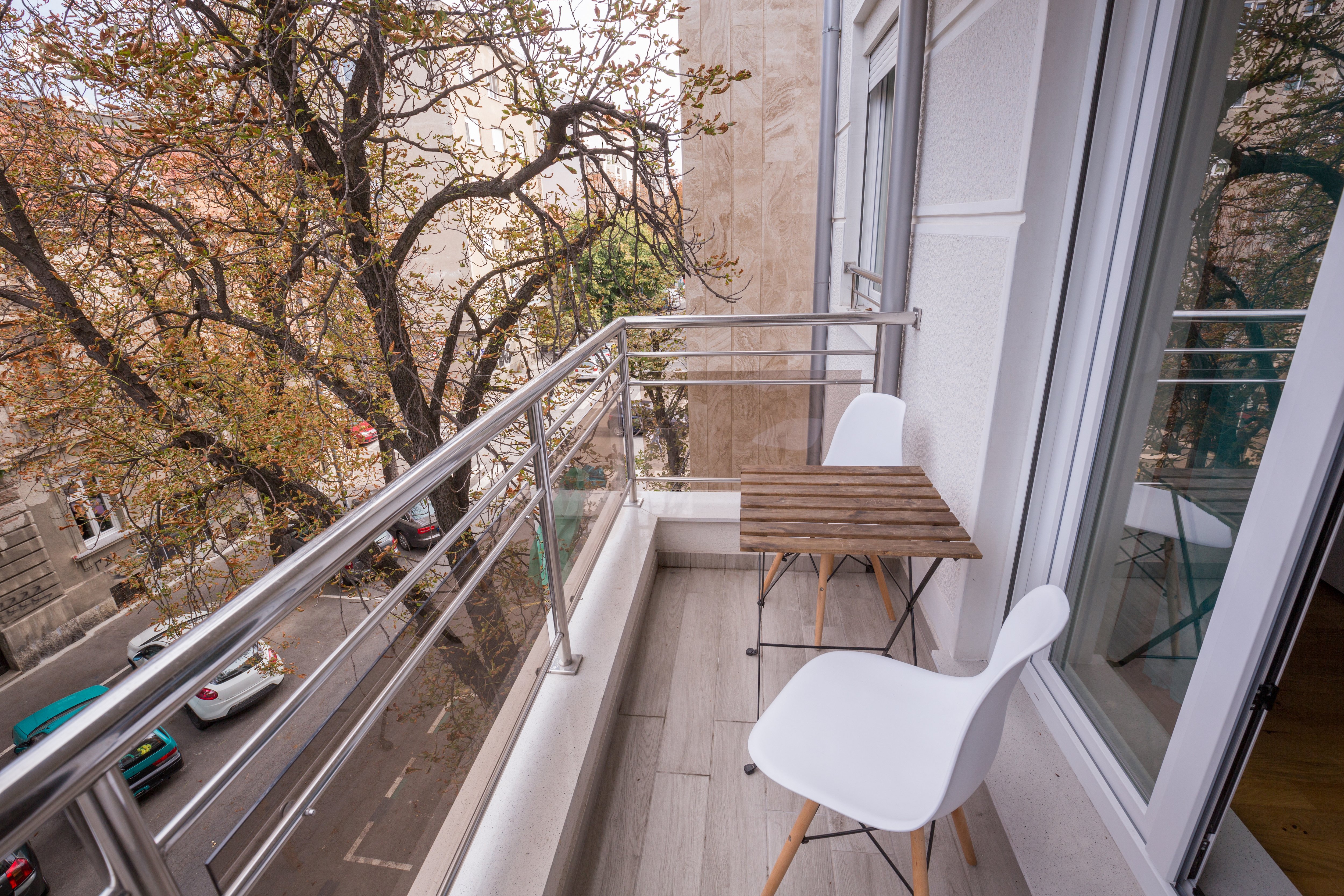 Glass panel railing on small balcony