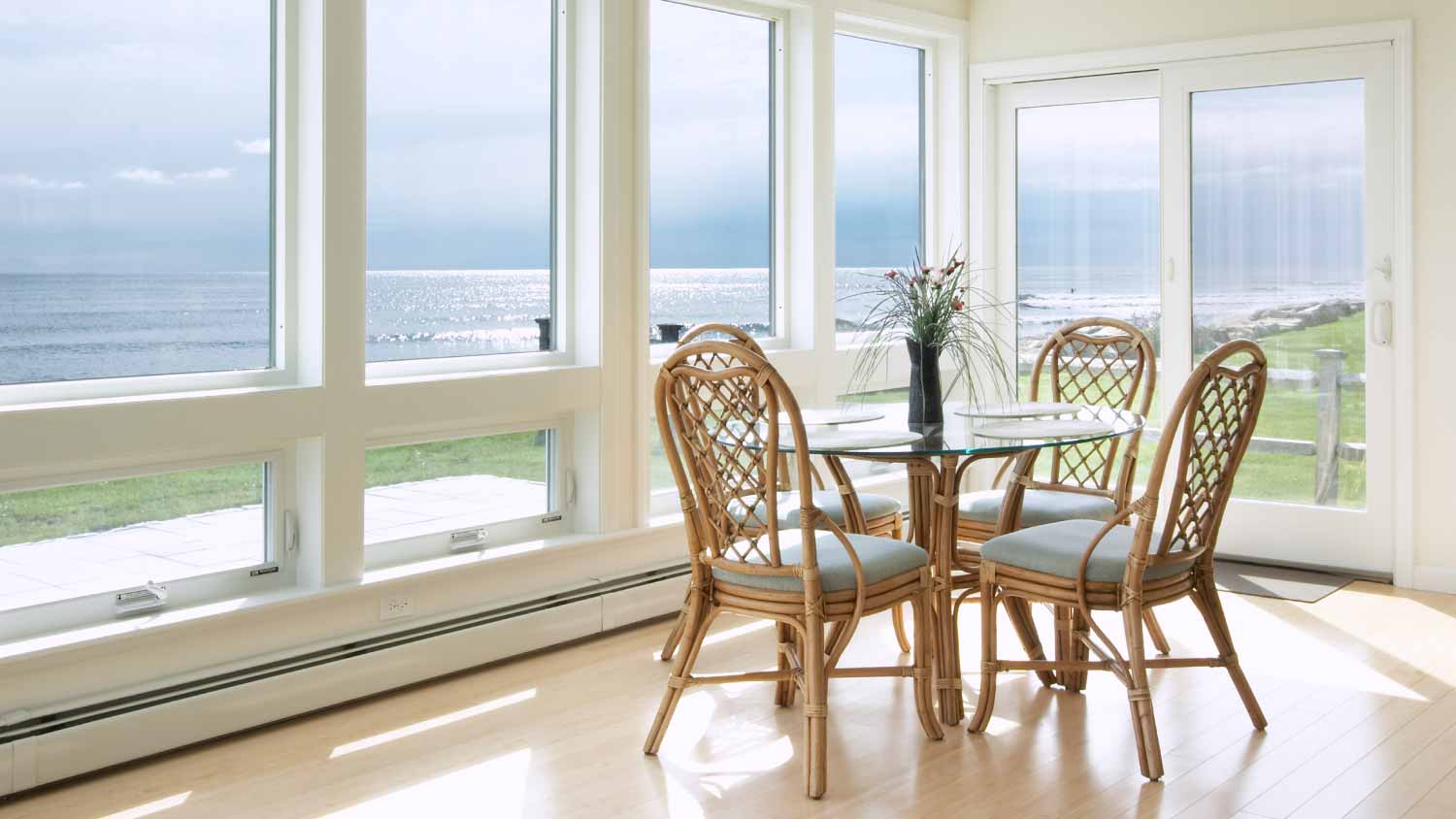 A small breakfast table in a sunroom