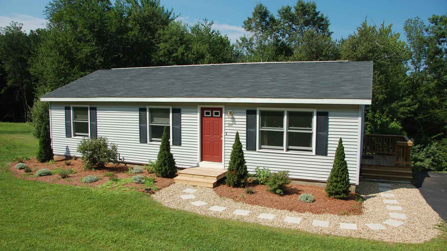 A small house with vinyl siding