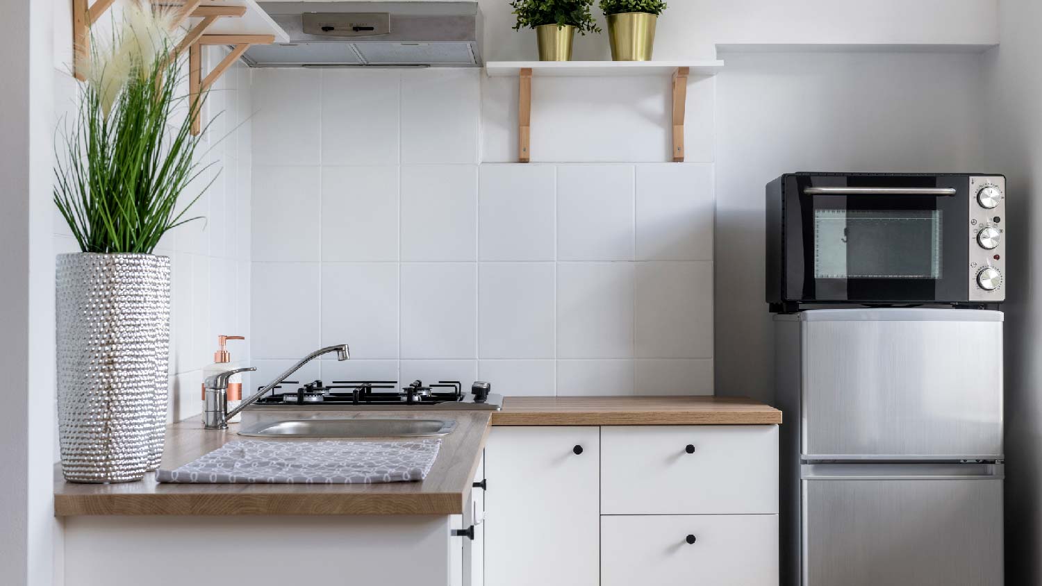 A small kitchen with euro style cabinets