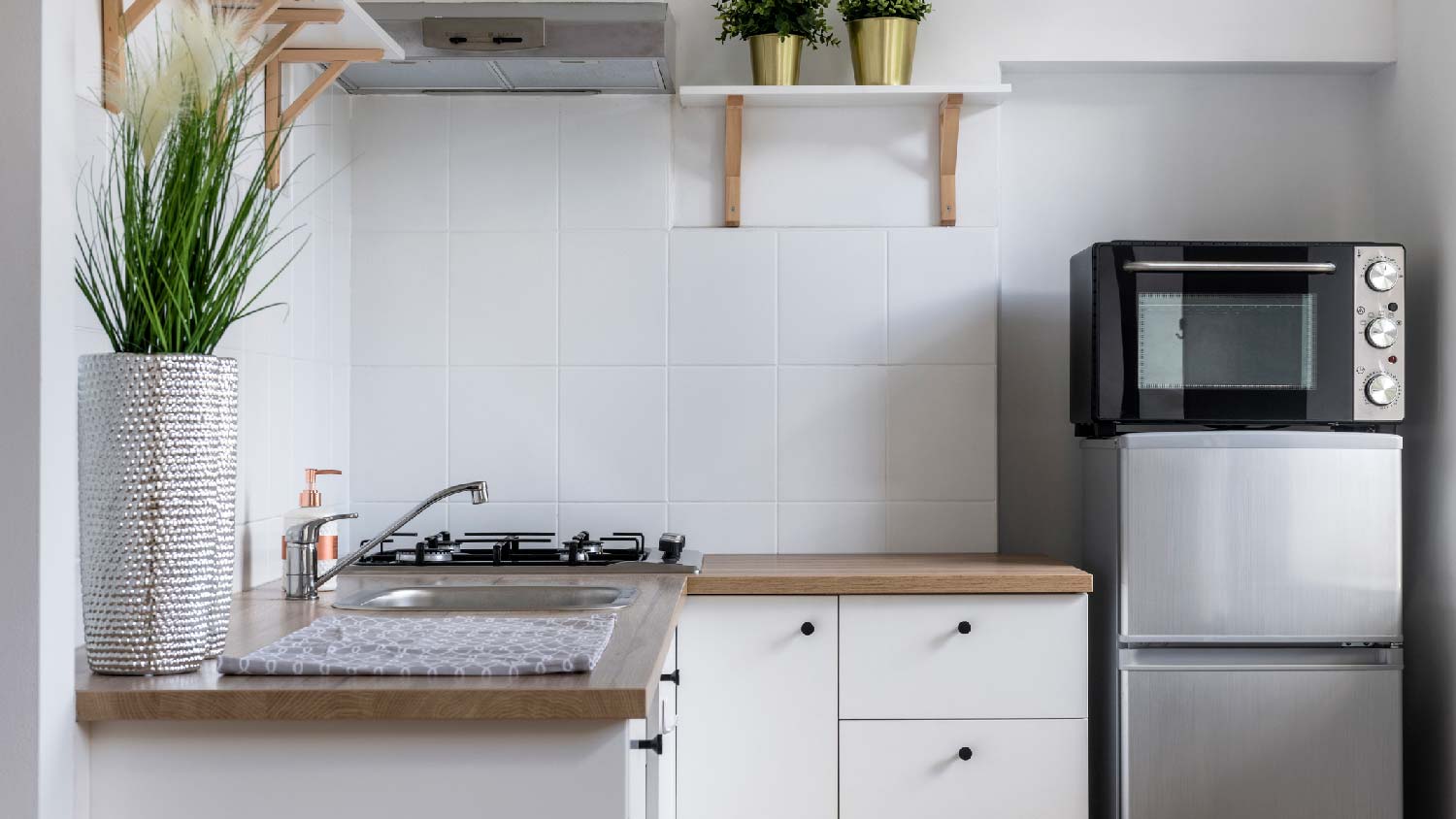 A small kitchen with euro style cabinets