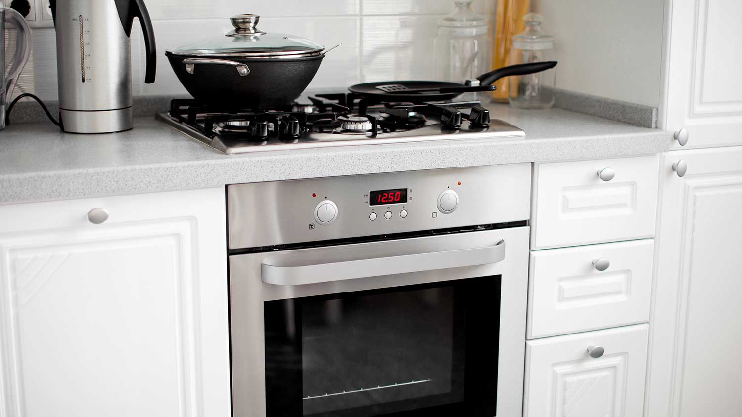 Small kitchen range with pans on top