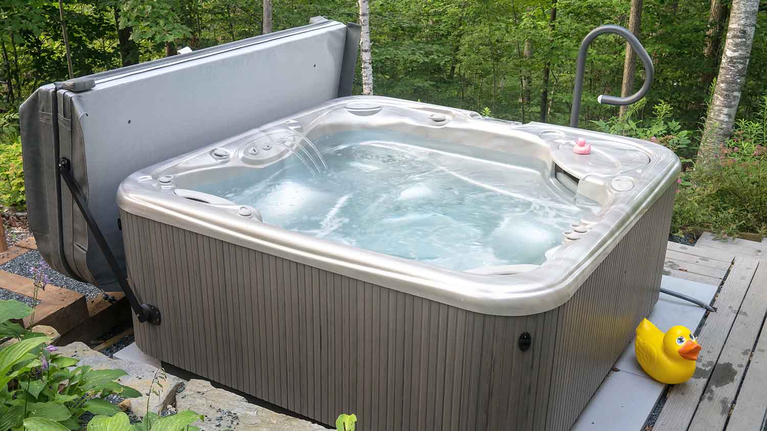 Hot tub placed on a deck with a smartop cover 