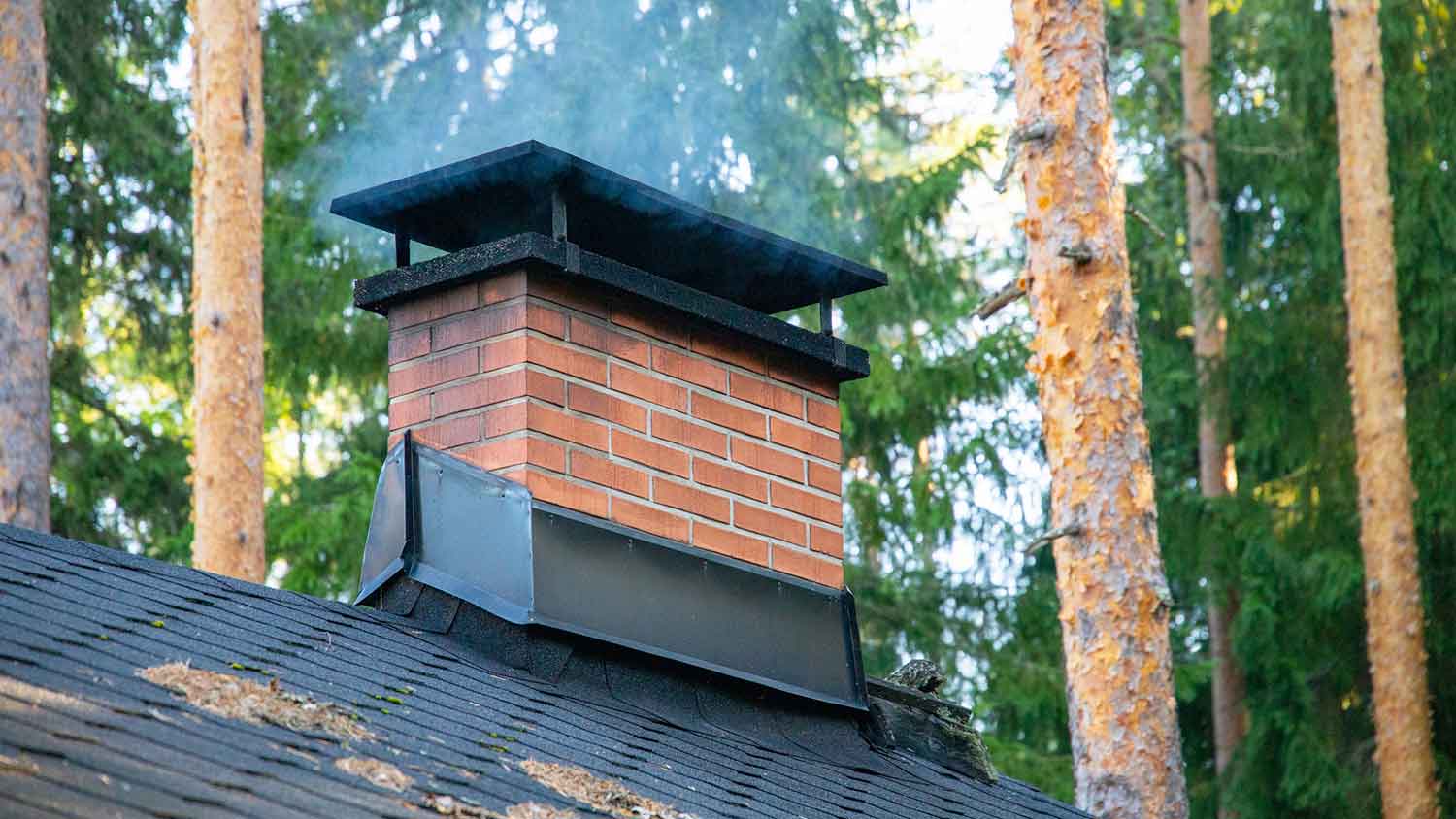 Smoke coming out of a residential chimney