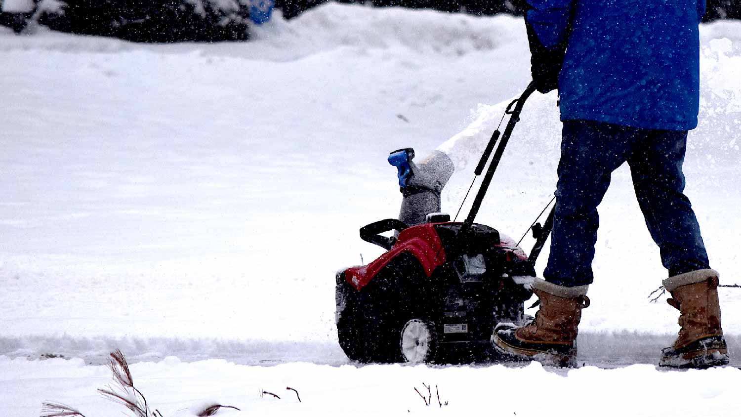 A person using a snow blower